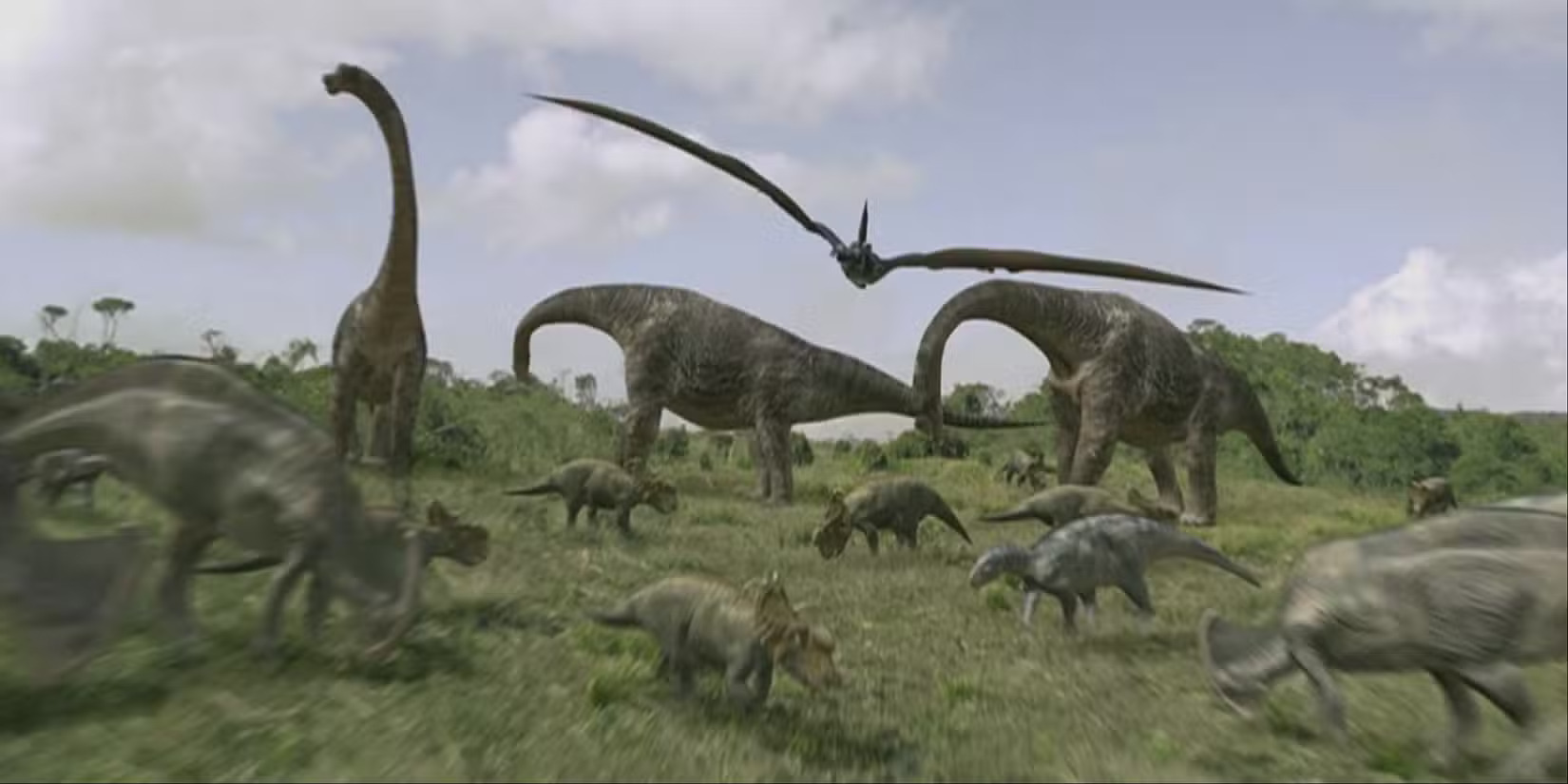 大草原を移動する恐竜たちの群れ